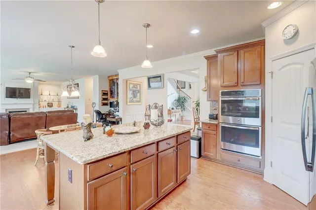 a living room with furniture a chandelier and a rug