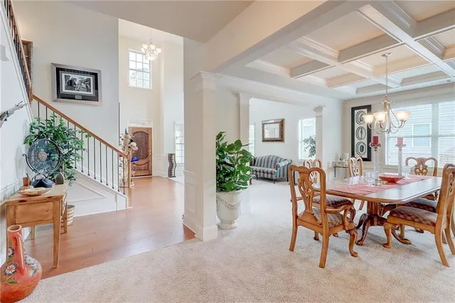 a view of a livingroom with furniture and a ceiling fan