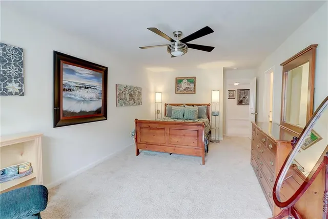 a aerial view of a house with swimming pool and sitting area
