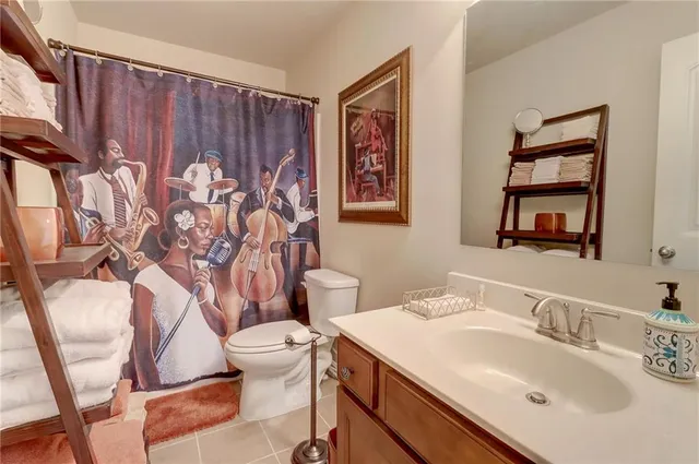 an aerial view of a house with a yard basket ball court and outdoor seating