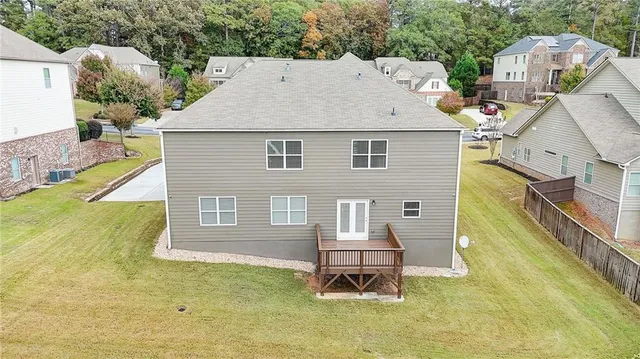 a front view of a house with swimming pool having outdoor seating