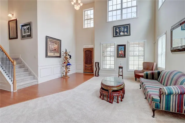 a dining room with furniture and chandelier