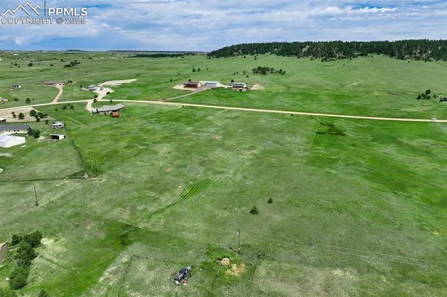 a view of a golf course with chairs