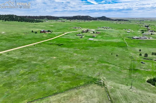 a view of a field with an outdoor space