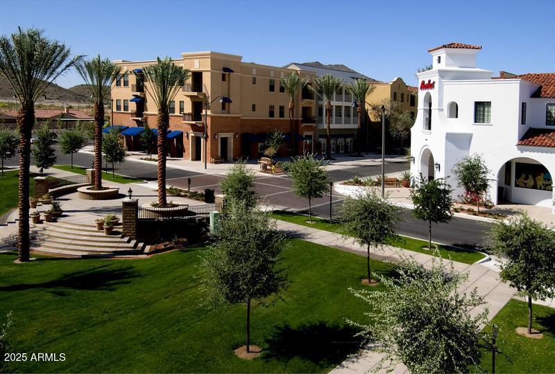 21287 North Black Rock Road, Unit 96 Buckeye, AZ 85396 - Photo 20 of 53 a front view of a house with garden