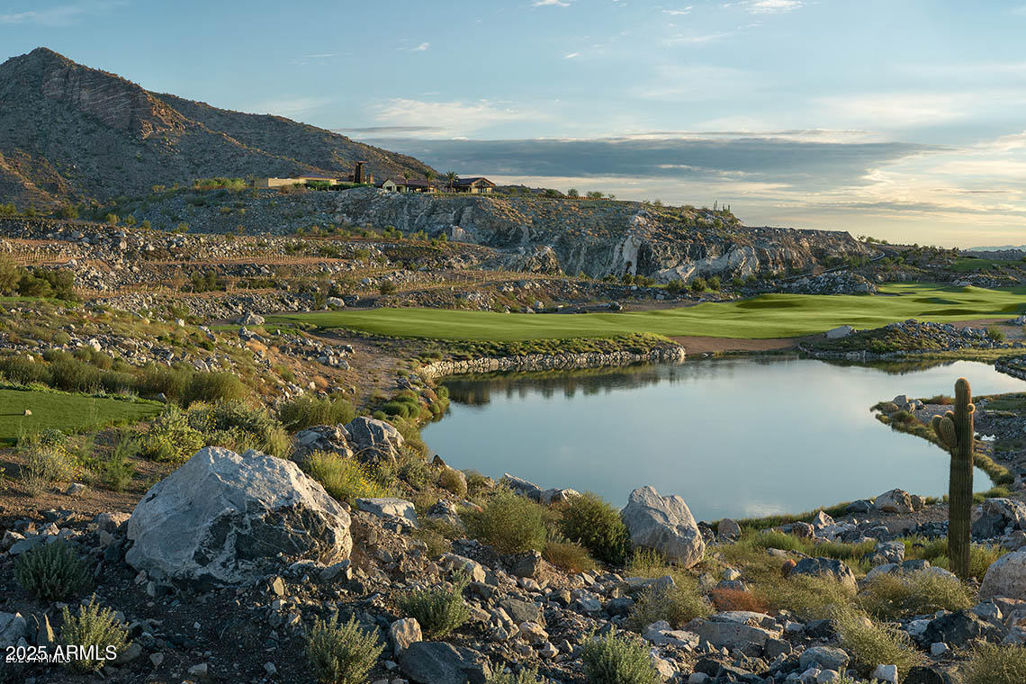 21287 North Black Rock Road, Unit 96 Buckeye, AZ 85396 - Photo 38 of 53 a view of lake with mountain