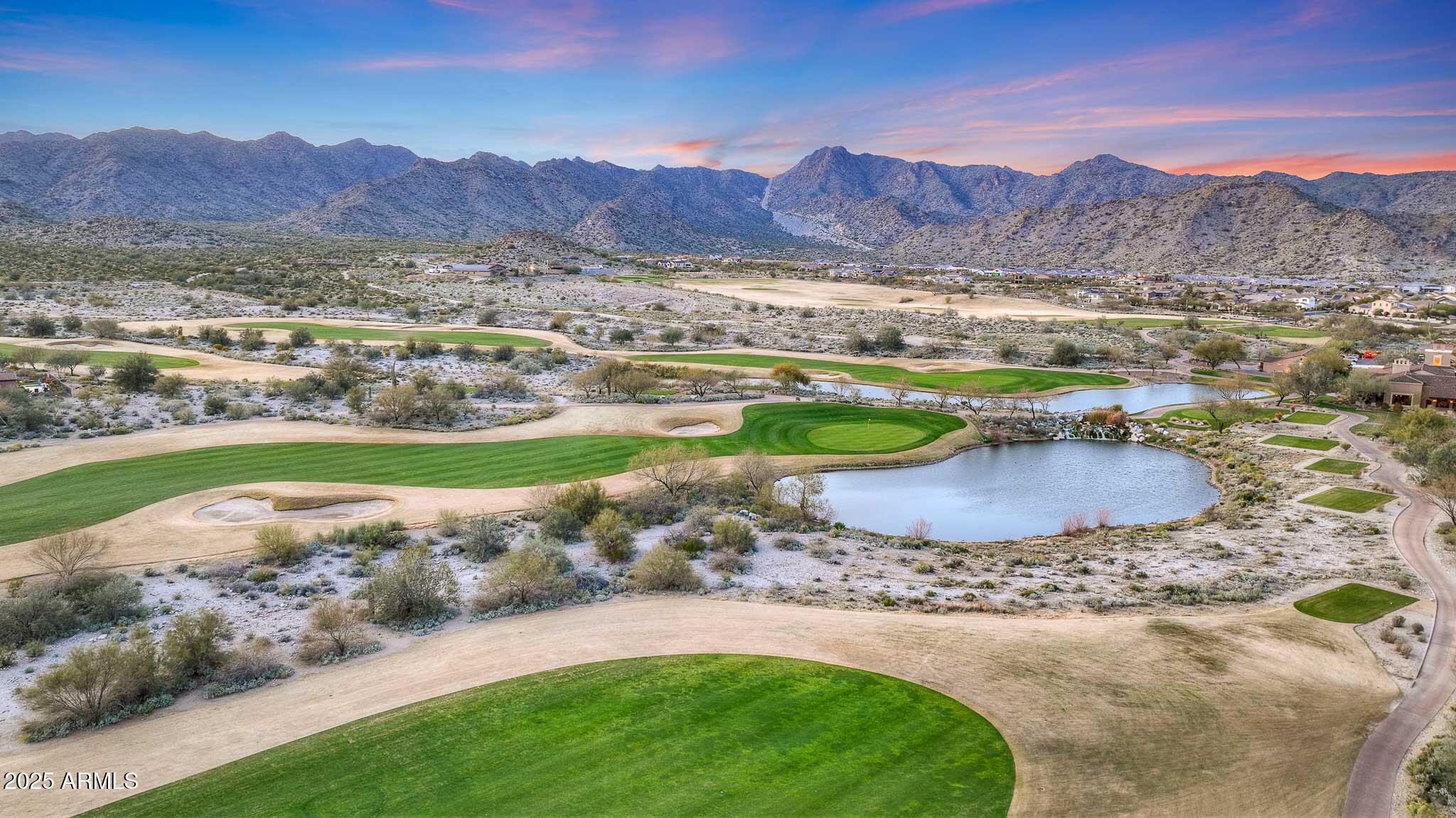 21287 North Black Rock Road, Unit 96 Buckeye, AZ 85396 - Photo 41 of 53 a view of a lush green hillside and houses