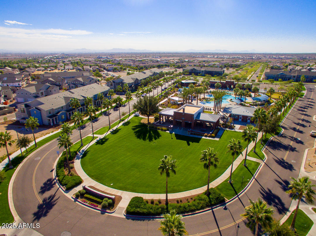 21287 North Black Rock Road, Unit 96 Buckeye, AZ 85396 - Photo 45 of 53 an aerial view of a swimming pool a yard and lake view