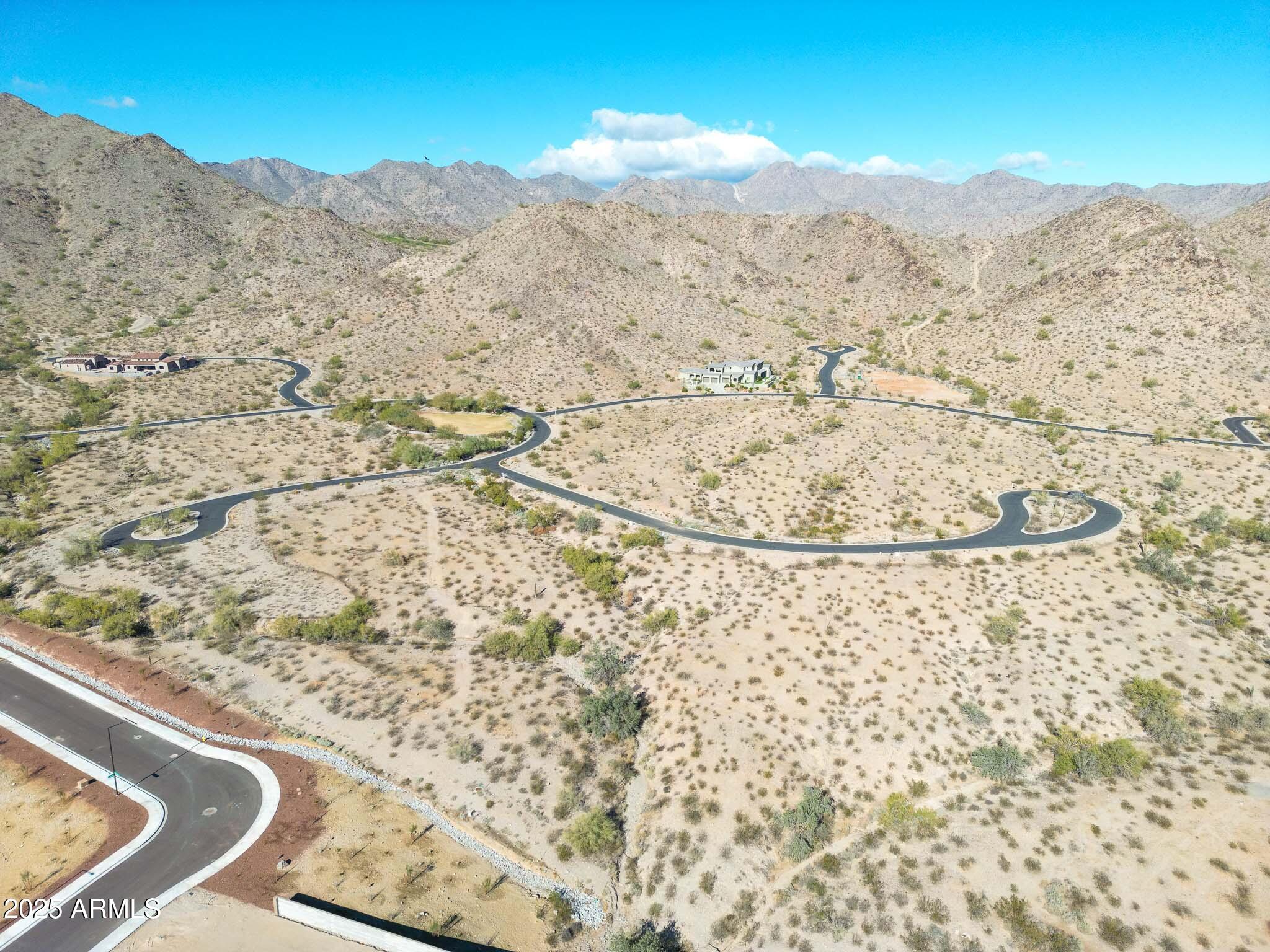 21287 North Black Rock Road, Unit 96 Buckeye, AZ 85396 - Photo 7 of 53 a view of a mountain from a lake