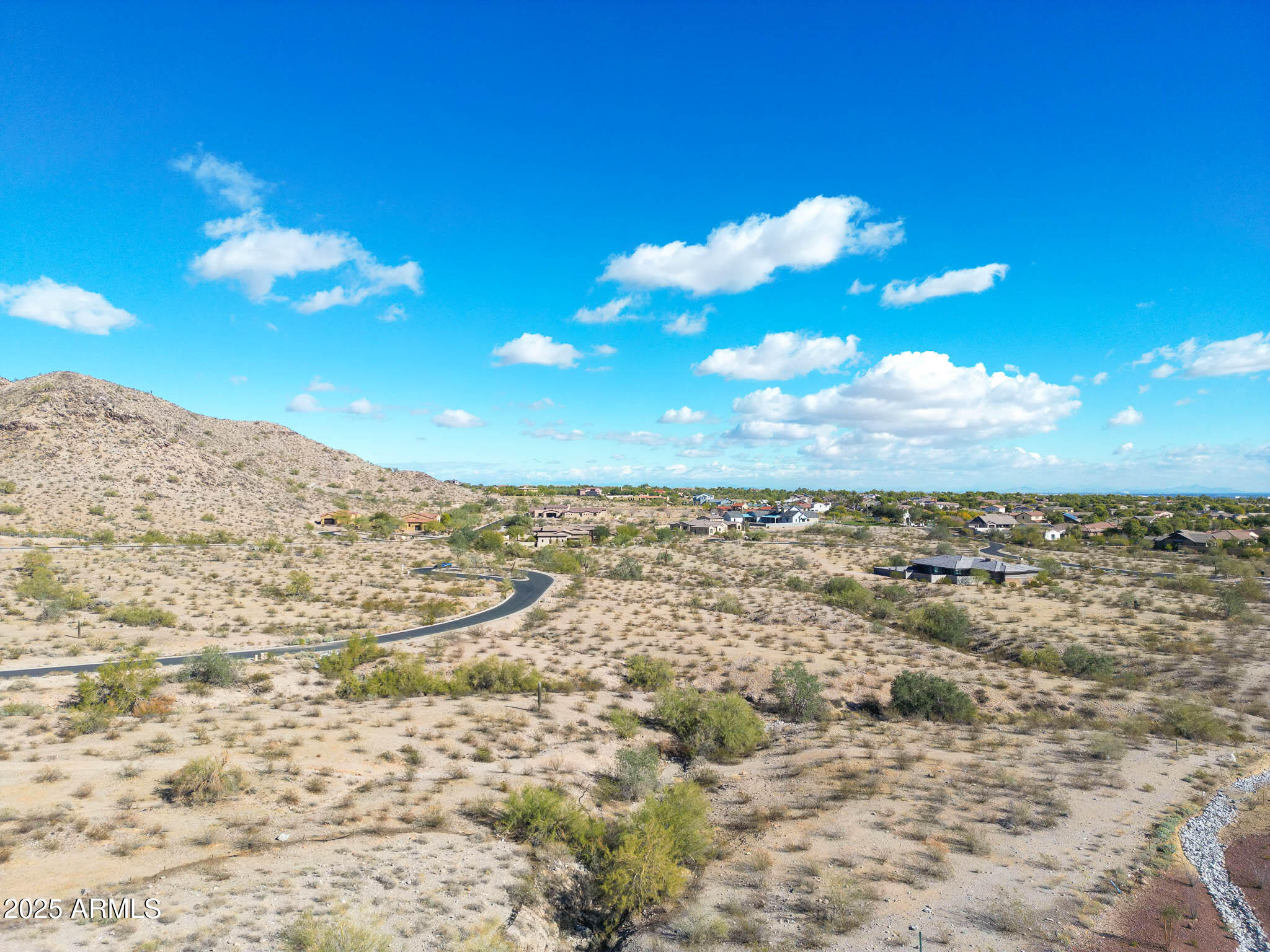 21287 North Black Rock Road, Unit 96 Buckeye, AZ 85396 - Photo 10 of 53 a view of a yard with a city