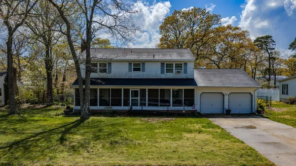 front view of a house with a garden
