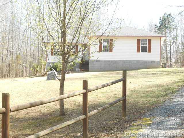 7441 Tuckaseegee Road Kannapolis, NC 28081 - Photo 2 of 14 a view of a backyard of the house