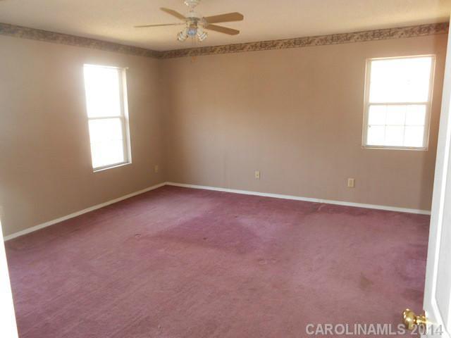 7441 Tuckaseegee Road Kannapolis, NC 28081 - Photo 11 of 14 an empty room with a window
