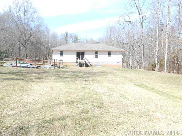 7441 Tuckaseegee Road Kannapolis, NC 28081 - Photo 13 of 14 a front view of a building with a yard