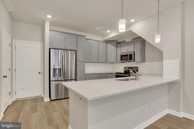 a bedroom with a bed and a night stand