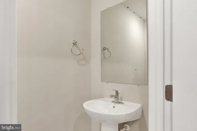 a view of a balcony with couch and potted plants
