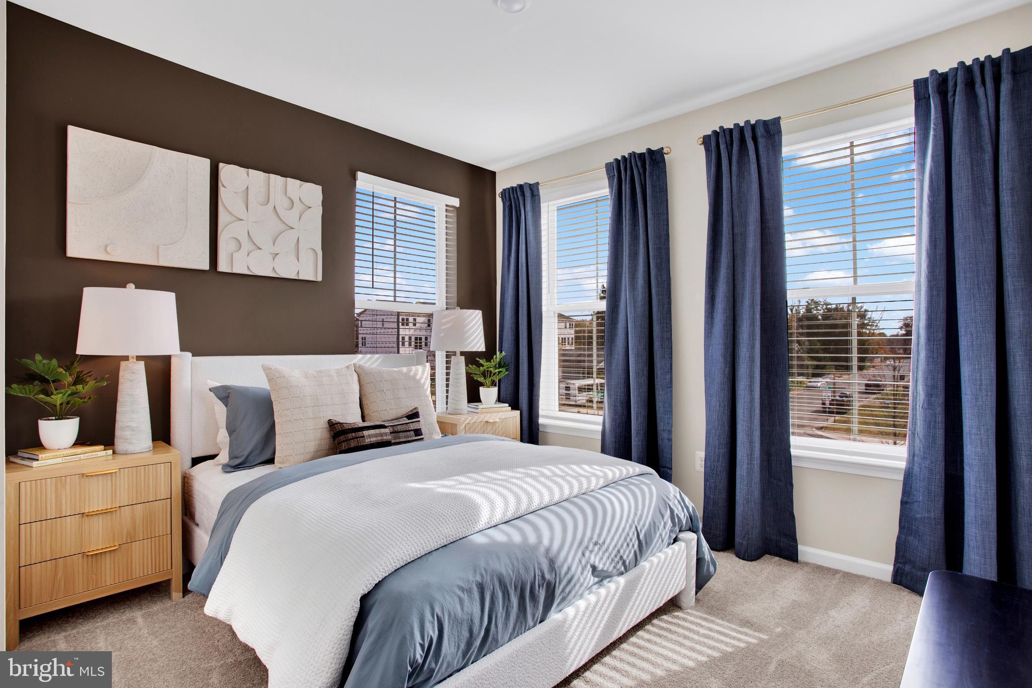 9664 Swallowtail Lane Manassas, VA 20110 - Photo 27 of 95 a bedroom with a large bed and a large window