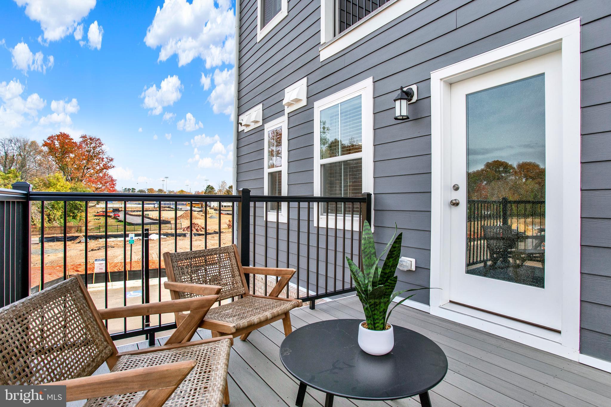 9664 Swallowtail Lane Manassas, VA 20110 - Photo 35 of 95 a view of a balcony with couch and potted plants