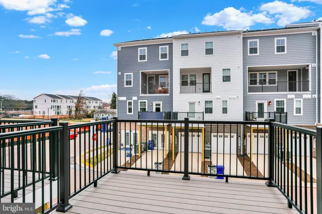 an aerial view of residential houses with city view