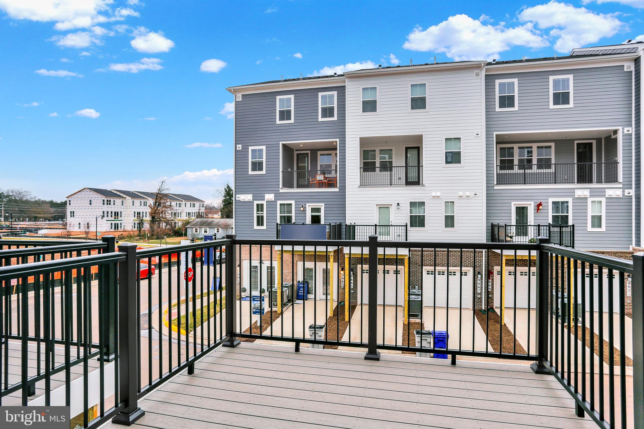 9664 Swallowtail Lane Manassas, VA 20110 - Photo 36 of 95 a view of a brick building from a balcony