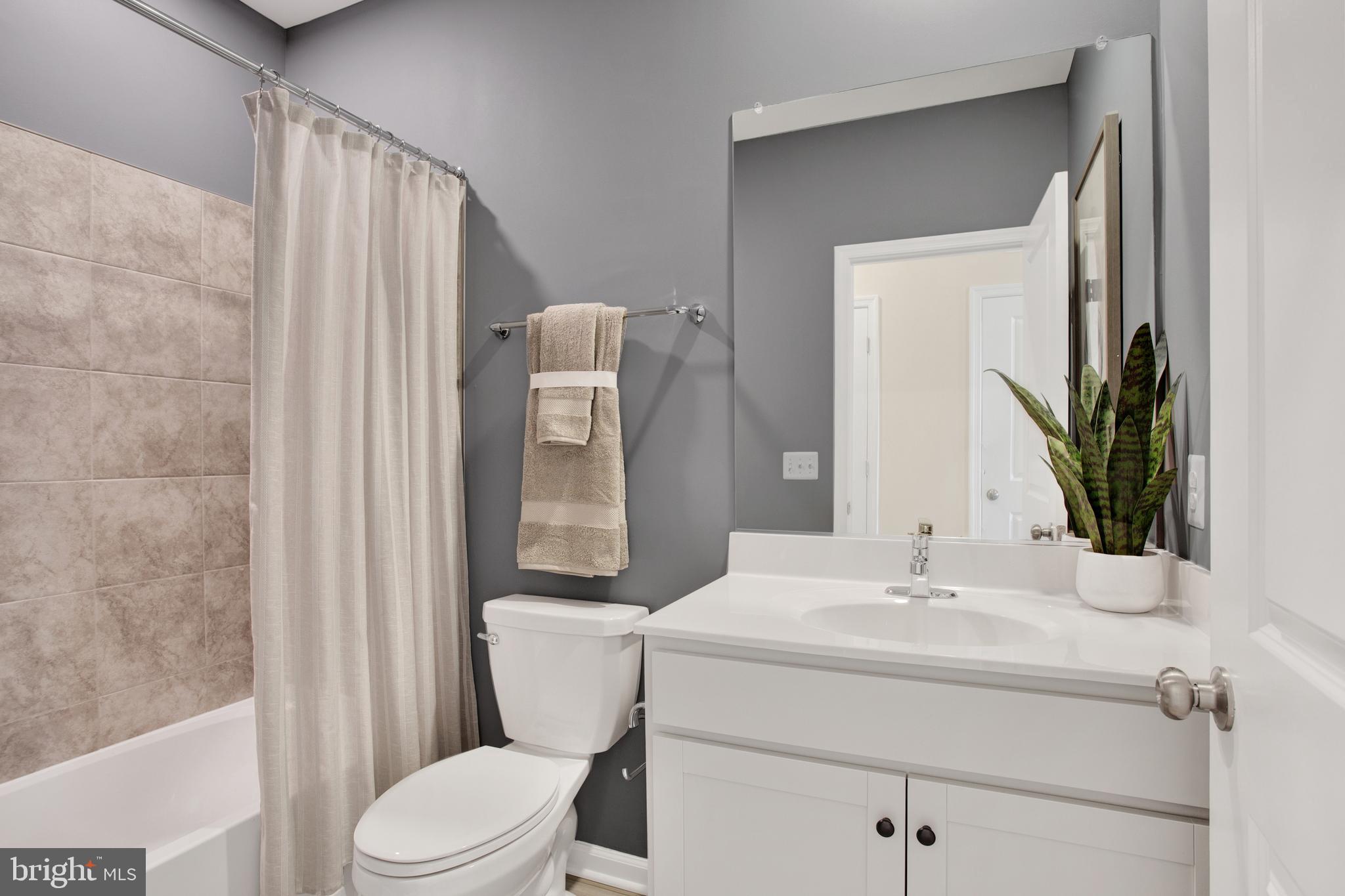 9664 Swallowtail Lane Manassas, VA 20110 - Photo 41 of 95 a bathroom with a sink toilet and shower