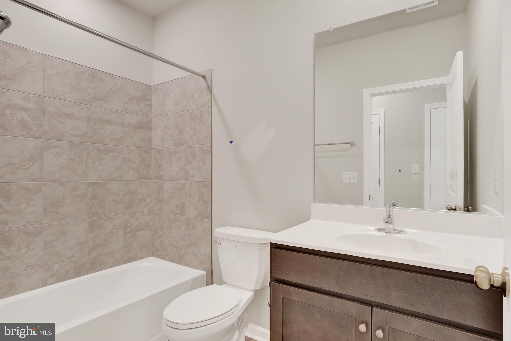 9664 Swallowtail Lane Manassas, VA 20110 - Photo 42 of 95 a bathroom with a sink toilet and shower