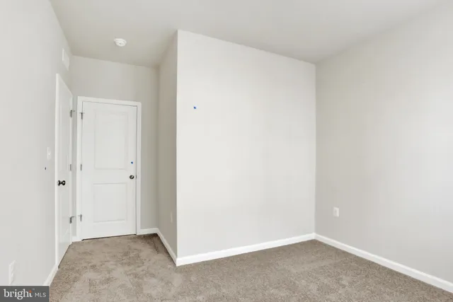 a view of a house with wooden fence