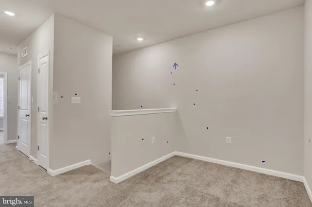 a view of the patio with a table and chairs and potted plants