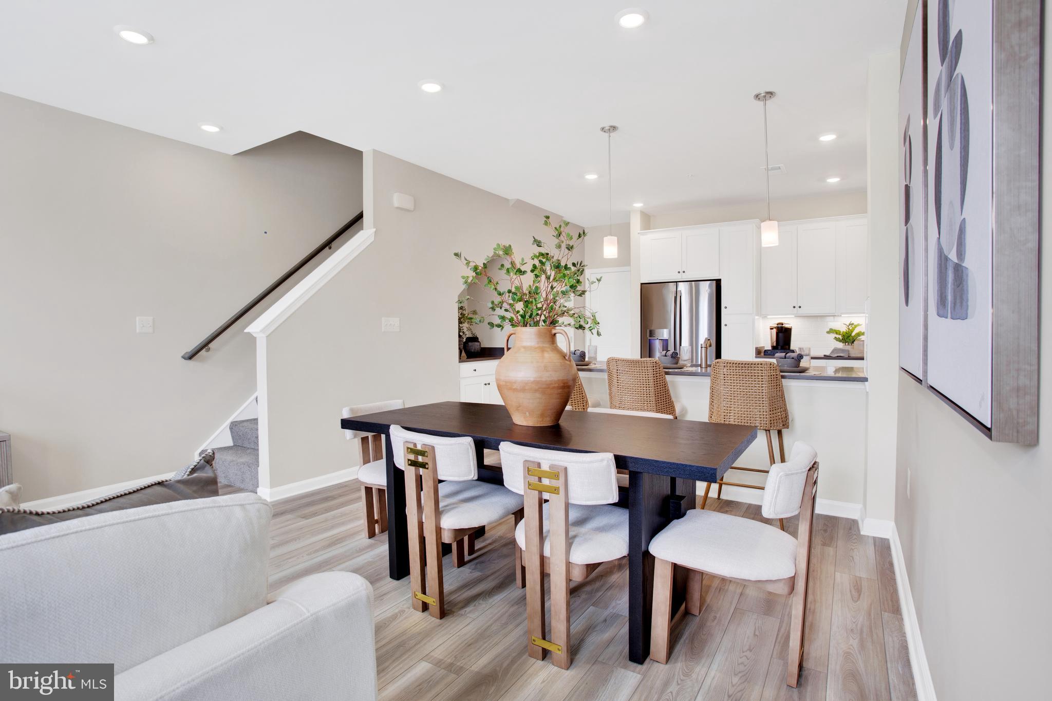 9664 Swallowtail Lane Manassas, VA 20110 - Photo 5 of 95 a dining room with furniture and wooden floor