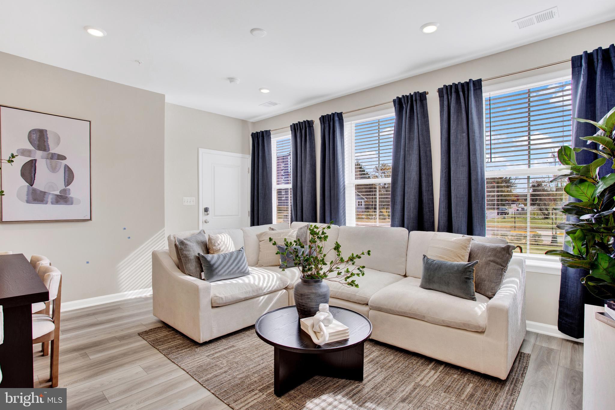 9664 Swallowtail Lane Manassas, VA 20110 - Photo 10 of 95 a living room with furniture and a large window