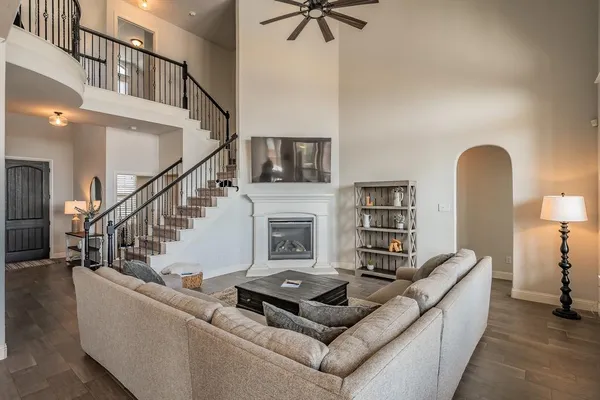 a living room with furniture and a fireplace