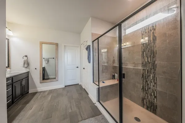 a room with gym equipment and windows