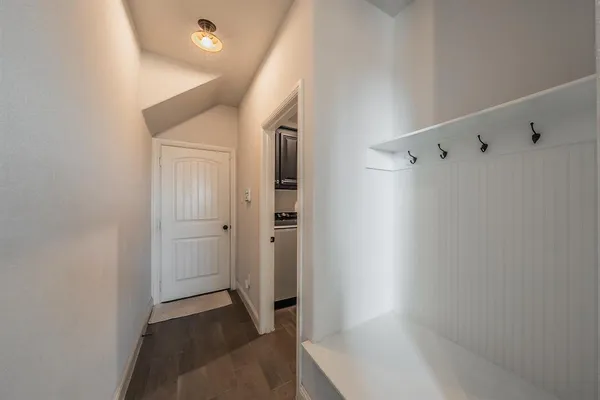 a bathroom with a sink a vanity and a large mirror