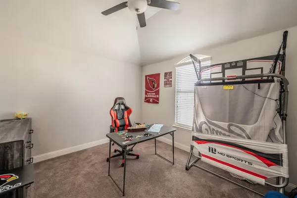 a bedroom with a bed and flat screen tv