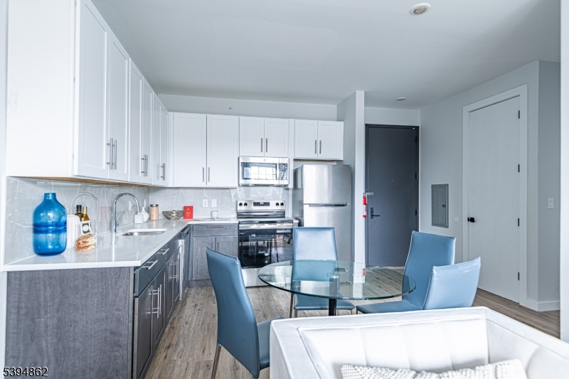 75 South Main Street, Unit 405 Phillipsburg, NJ 08865 - Photo 12 of 22 a kitchen with stainless steel appliances a refrigerator and cabinets