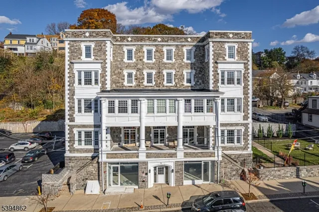a front view of a building with a lot of windows