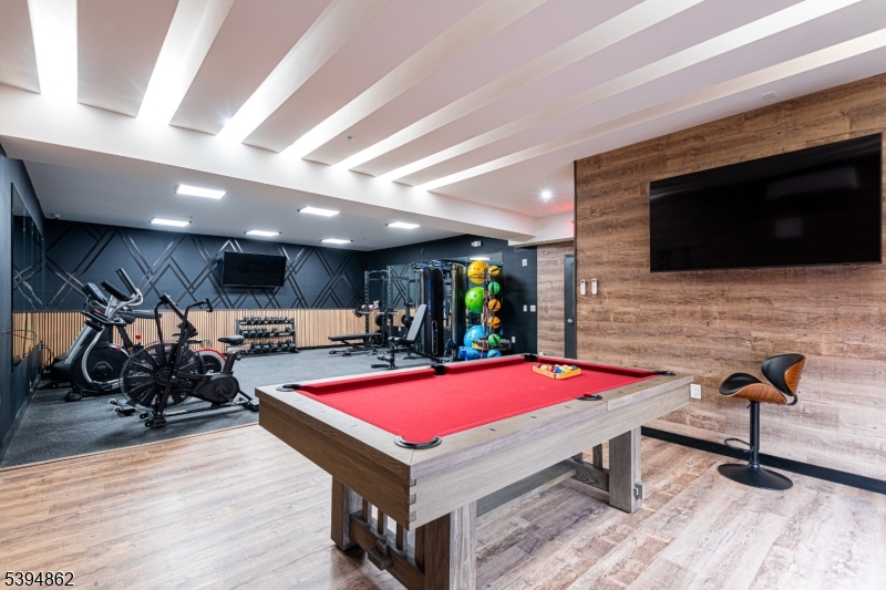 75 South Main Street, Unit 405 Phillipsburg, NJ 08865 - Photo 7 of 22 a room with furniture pool table flat screen tv and windows