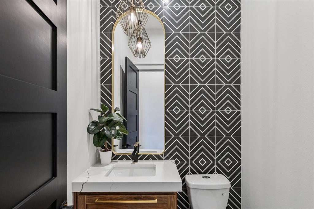 1890 McConnell Road Gunter, TX 75058 - Photo 11 of 40 a bathroom with a sink and a mirror