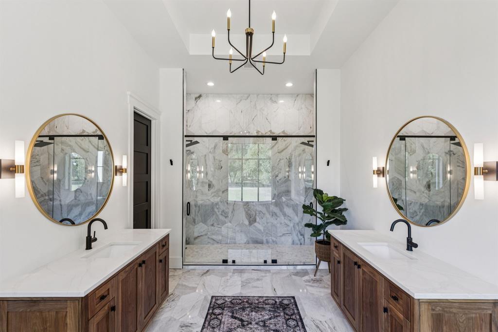 1890 McConnell Road Gunter, TX 75058 - Photo 18 of 40 a bathroom with a sink a mirror and vanity