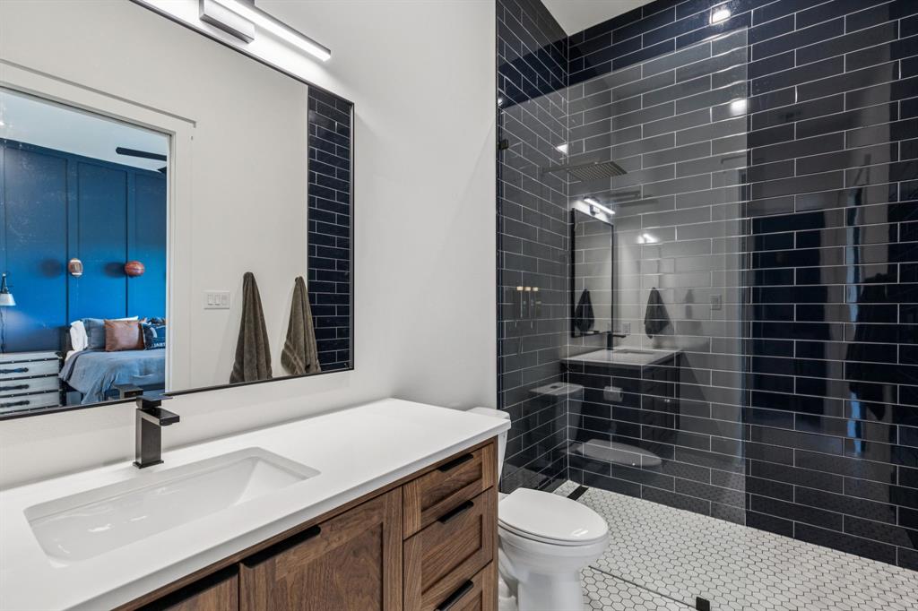 1890 McConnell Road Gunter, TX 75058 - Photo 23 of 40 a bathroom with a sink toilet and shower