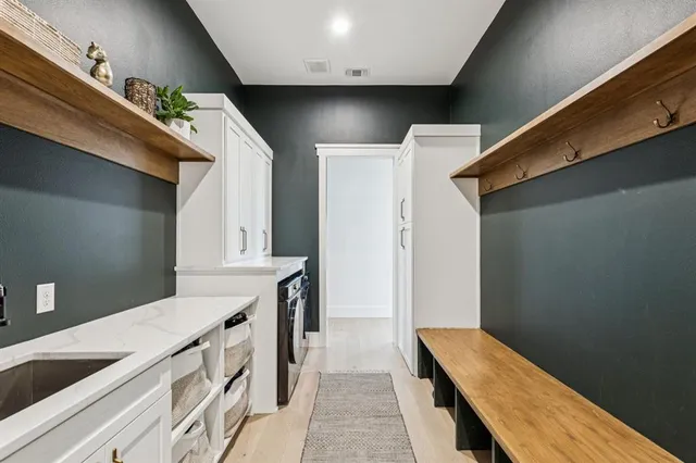 a view of a kitchen cabinets and a wooden floor