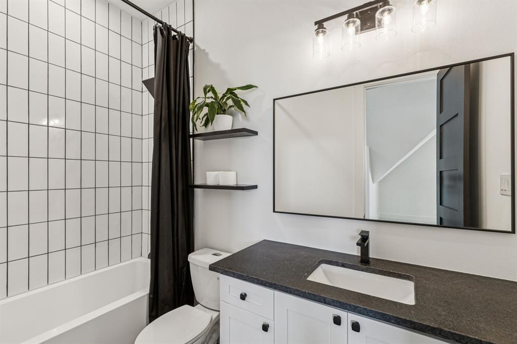 1890 McConnell Road Gunter, TX 75058 - Photo 27 of 40 a bathroom with a sink and a mirror