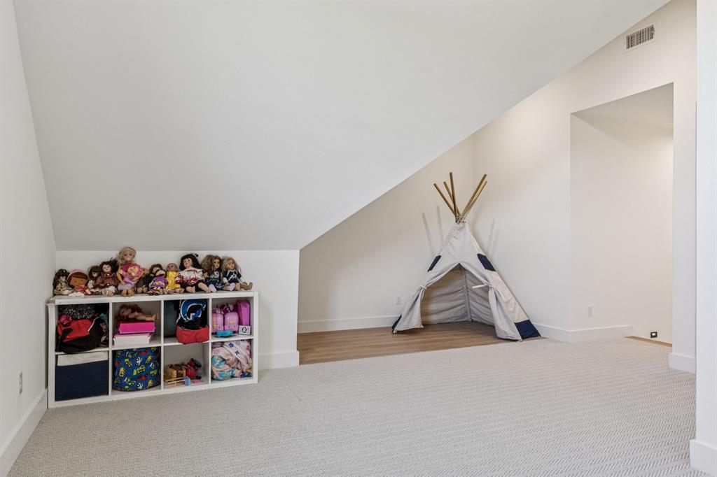 1890 McConnell Road Gunter, TX 75058 - Photo 29 of 40 a view of a garage with rack and white walls
