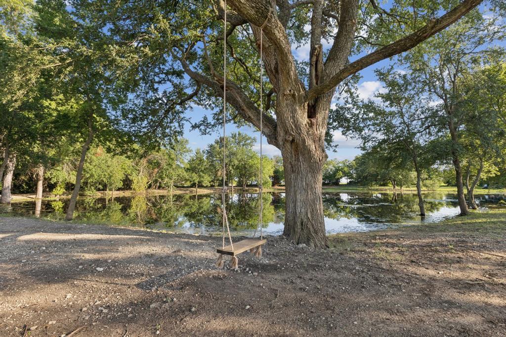 1890 McConnell Road Gunter, TX 75058 - Photo 35 of 40 a backyard of a house with lots of green space