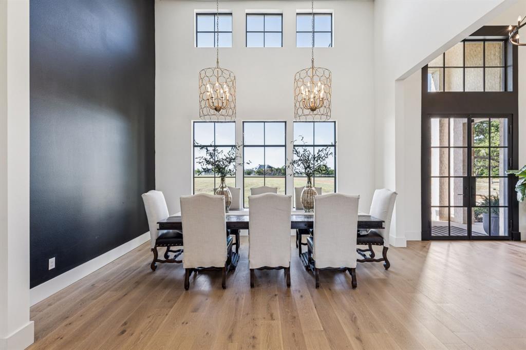 1890 McConnell Road Gunter, TX 75058 - Photo 9 of 40 a view of a dining room with furniture and wooden floor
