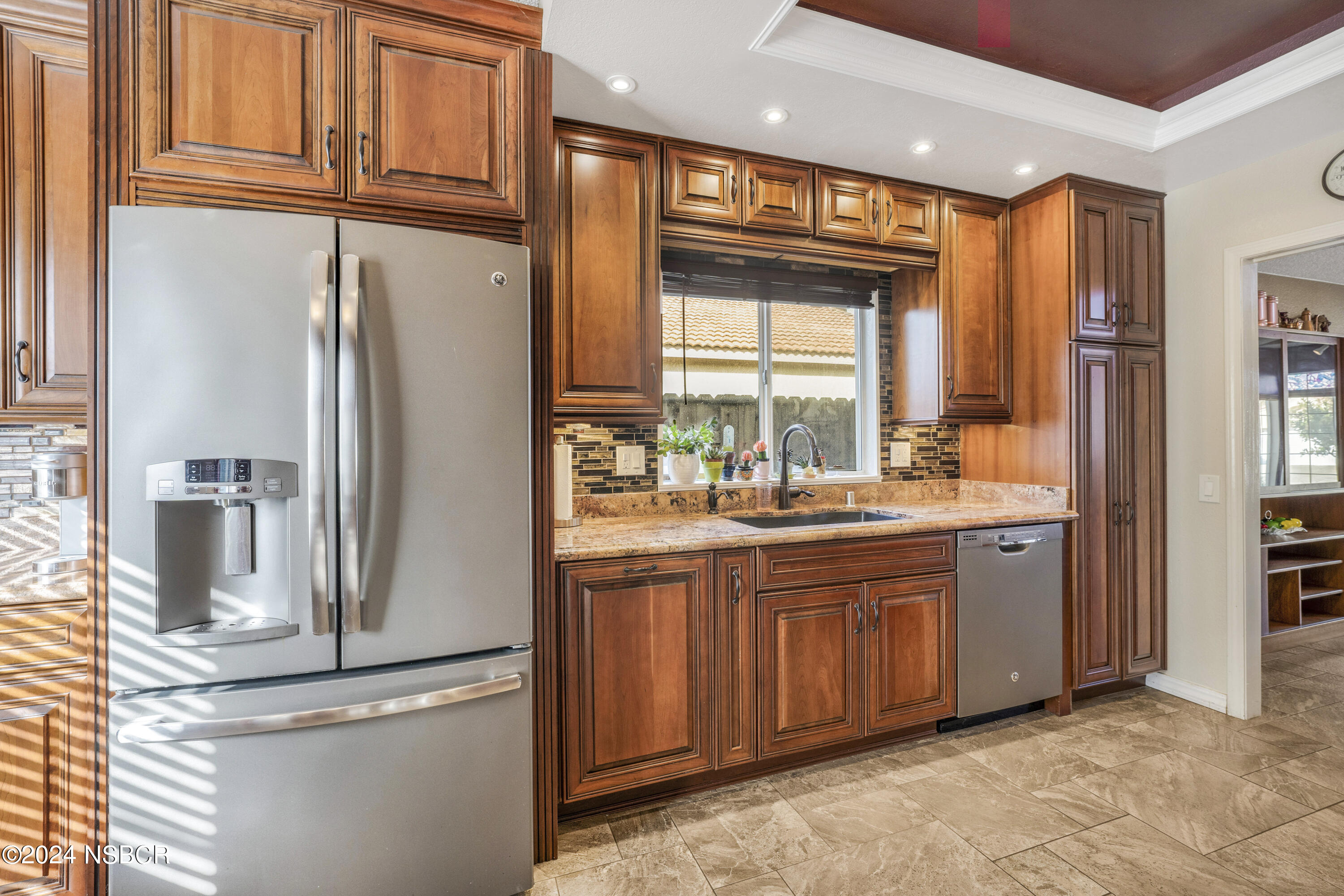 816 Cooper Drive Lompoc, CA 93436 - Photo 11 of 35 a kitchen with stainless steel appliances granite countertop a refrigerator and a sink