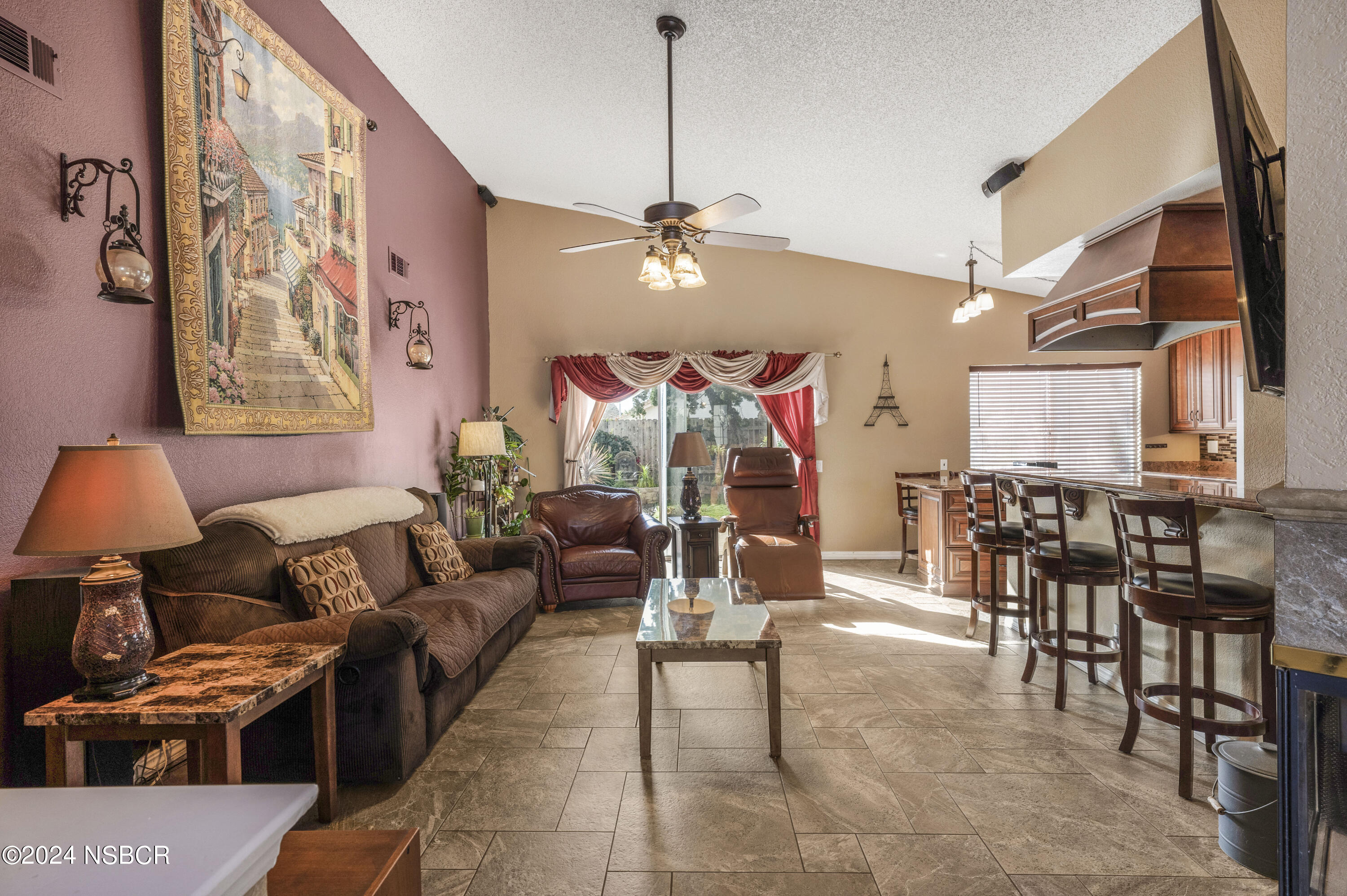 816 Cooper Drive Lompoc, CA 93436 - Photo 14 of 35 a living room with furniture a chandelier and a dining table