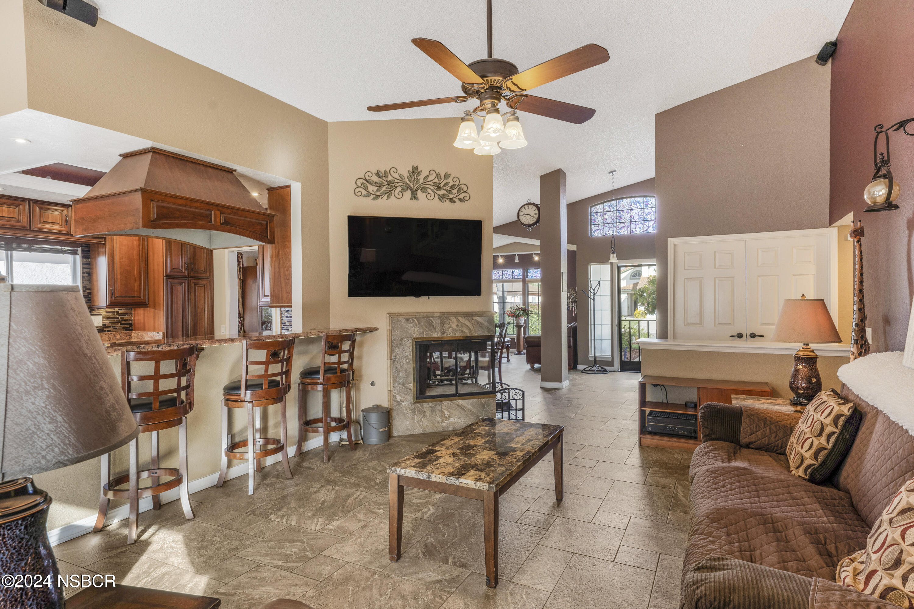 816 Cooper Drive Lompoc, CA 93436 - Photo 16 of 35 a living room with fireplace furniture and a flat screen tv