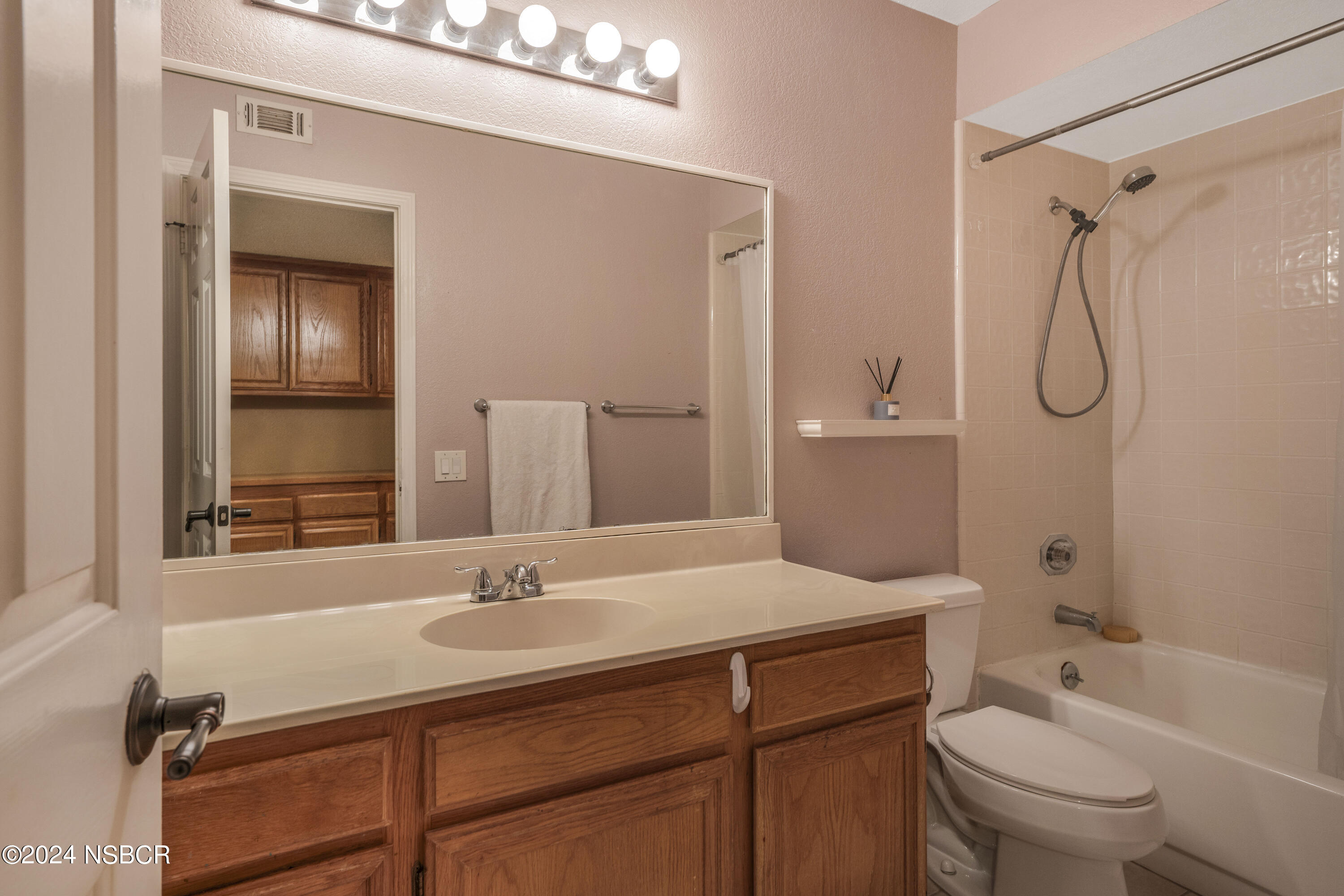 816 Cooper Drive Lompoc, CA 93436 - Photo 18 of 35 a bathroom with a sink a toilet and shower