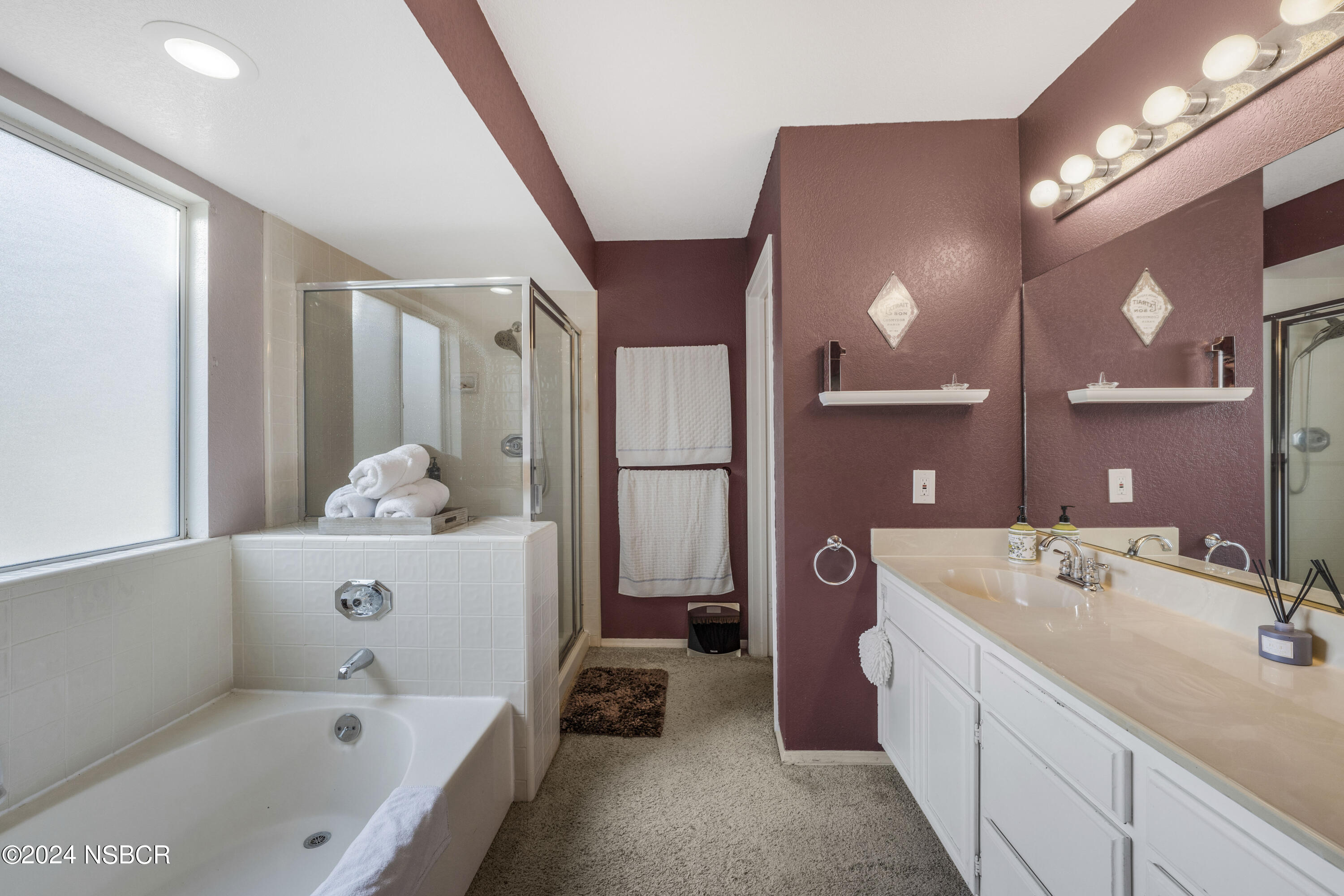 816 Cooper Drive Lompoc, CA 93436 - Photo 24 of 35 a bathroom with a tub sink and mirror